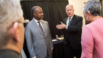 UC Davis Chancellor Gary May and Governor Jerry Brown chat before joining the symposium honoring the California Air Resources Board 50th Anniversary Symposium at the UC Davis Conference Center on Friday, January 19, 2017.