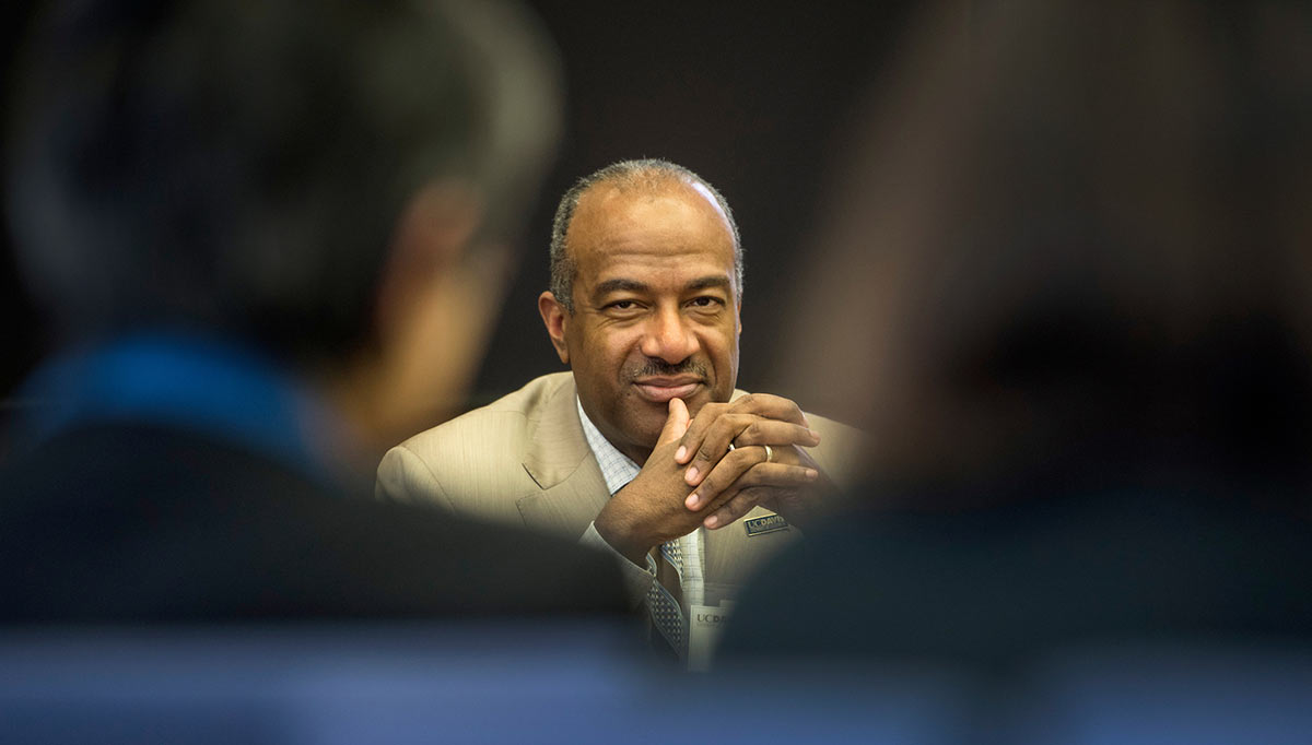 UC Davis Chancellor Gary May smiles at a meeting