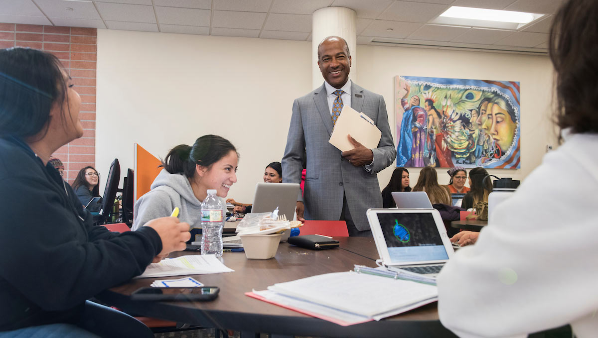 UC Davs Chancellor Gary S. May visiting students in the classroom