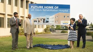 The forthcoming hospital, depicted on a sign unveiled at a news conference today, is celebrated by, from left, Jason Zachariah, president of Kindred Rehabilitation Services; Chancellor Gary S. May; Congresswoman Doris Matsui; and Sacramento Mayor Darrell Steinberg.