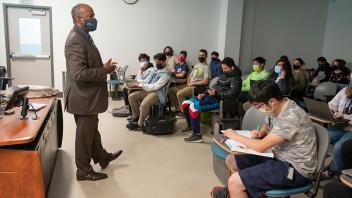 Photo of Chancellor Gary May teaching a lesson at the front of a UC Davis class