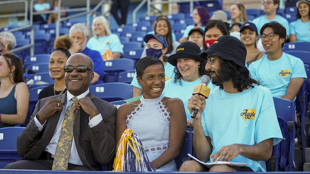 LeShelle May and Chancellor Gary May at a watch party in a stadium.  