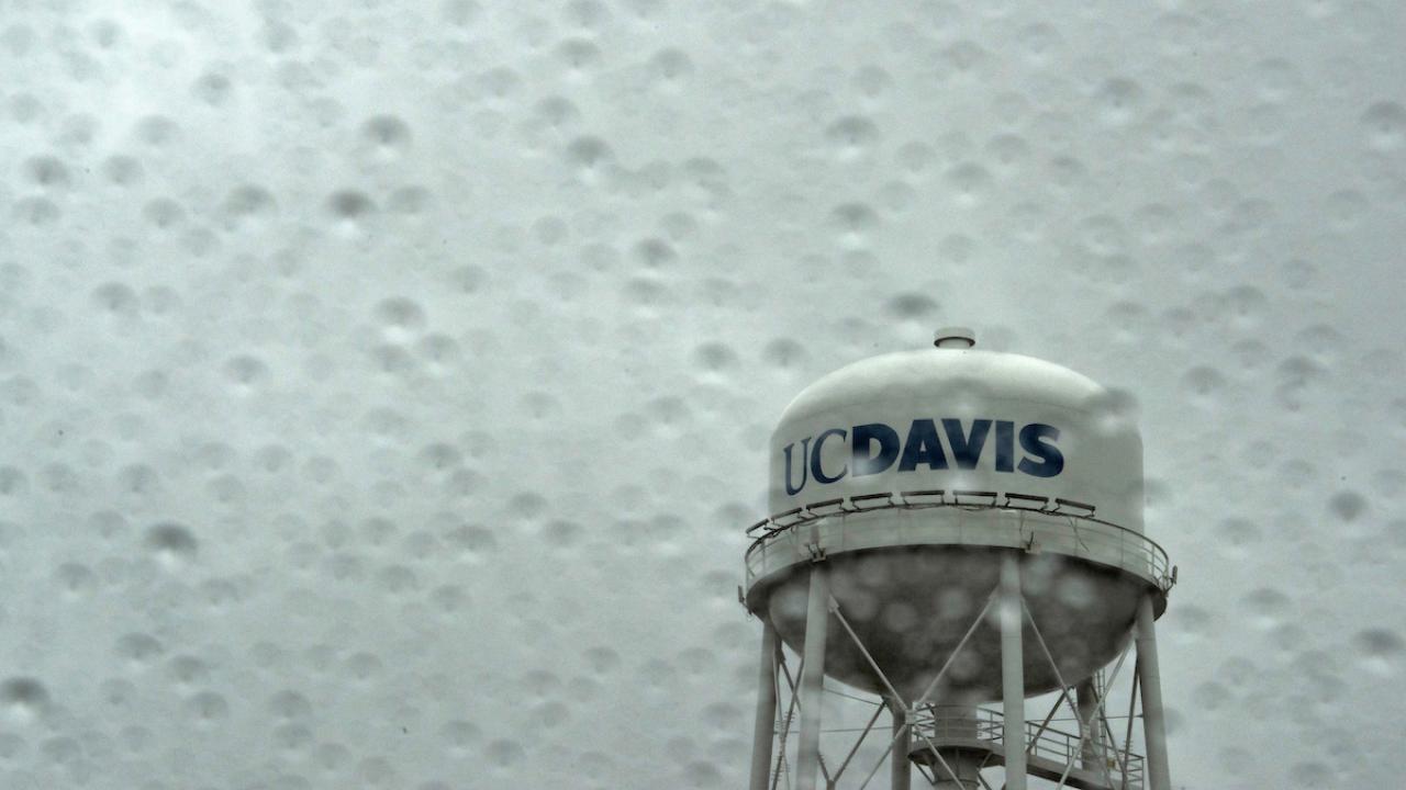 The UC Davis Water Tower in the rain during a heavy rain storm.