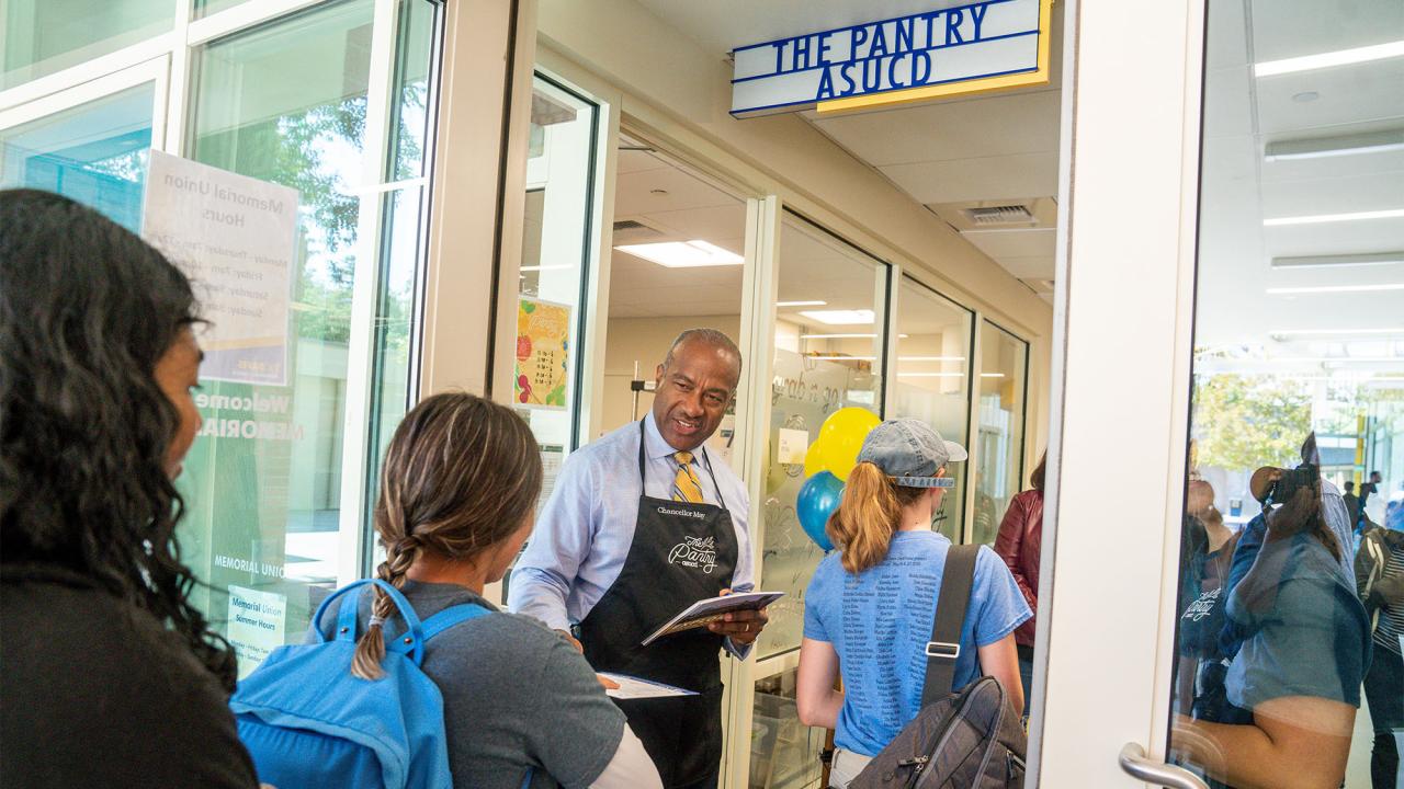 Chancellor May volunteering at The Pantry