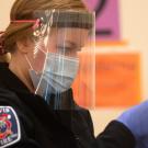 UC Davis EMT Amanda Sieverts works at giving patience vaccinations during the COVID-19 vaccine clinic in the Actives and Recreation Center