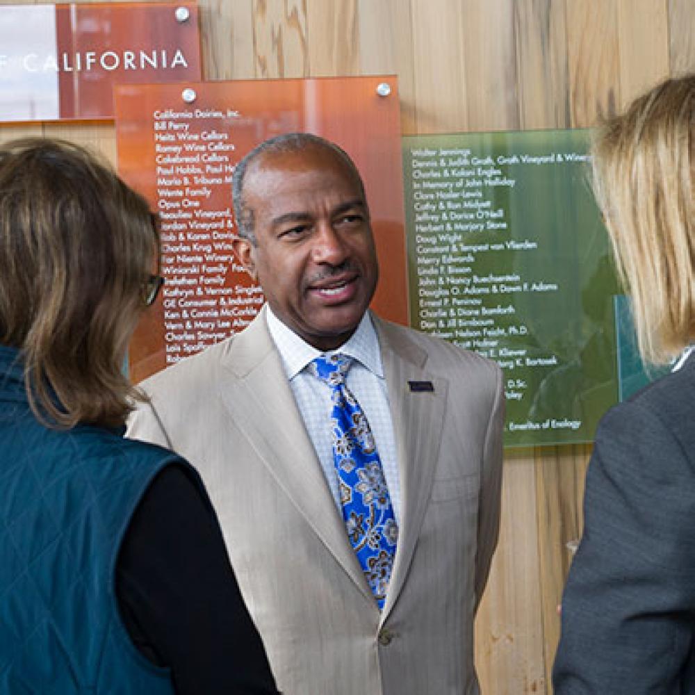 Chancellor Gary S May speaks with members of the public
